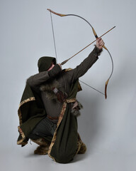 Full length  portrait of  young handsome man  wearing  medieval Celtic adventurer costume with...