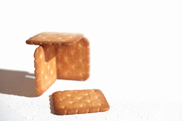 A closeup shot of the delicious crispy crackers on the white background.