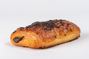 Neapolitan chocolate cake. Coated with chocolate chips