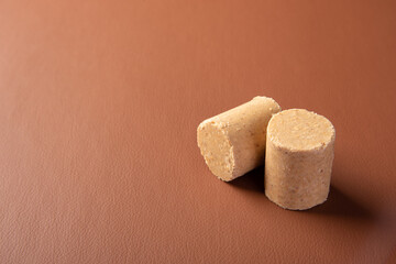 Peanut candy (paçoca or pacoca) Traditional Brazilian peanut-based candy on a leather surface. Selective Focus.