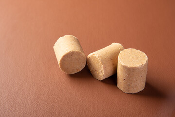 Peanut candy (paçoca or pacoca) Traditional Brazilian peanut-based candy on a leather surface. Selective Focus.