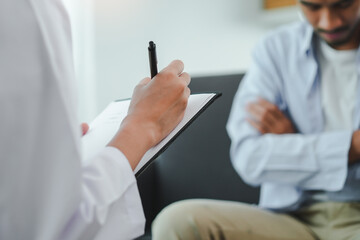 Men talk with a psychologist during talking therapy stressed mental health at office