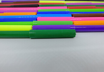 colorful markers isolated on a white background, top view