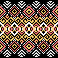 Ethnic pattern on. Black background, vector seamless pattern with yellow, pink, and white. Traditional geometric pattern design. Textile abstract pattern