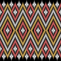Traditional textile pattern, ethnic pattern on black background, ikat pattern 
