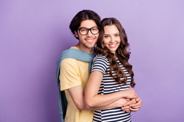 Photo of pretty adorable couple wear casual clothes spectacles smiling embracing isolated violet color background
