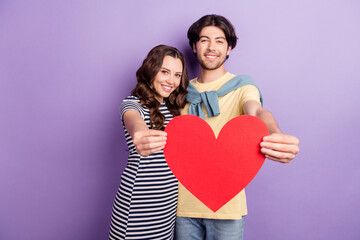 Fototapeta na wymiar Photo of sweet pretty lovers dressed casual outfit showing big red heart smiling isolated purple color background