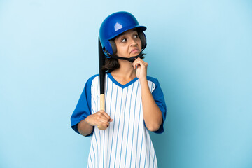 Baseball mixed race player woman with helmet and bat isolated on blue background and looking up