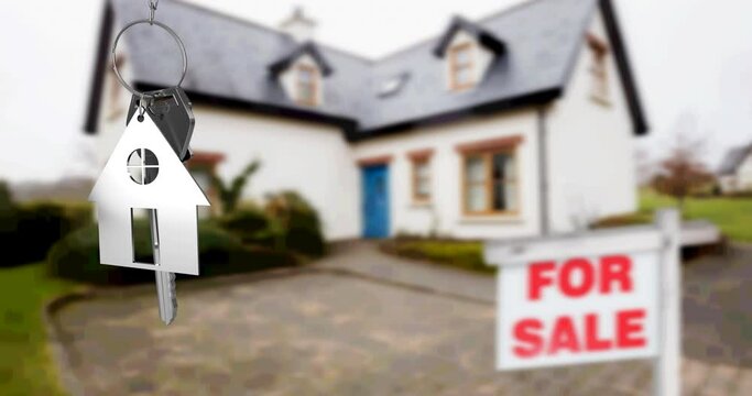 Animation of silver house key fob and key, hanging in front of blurred house with for sale sign