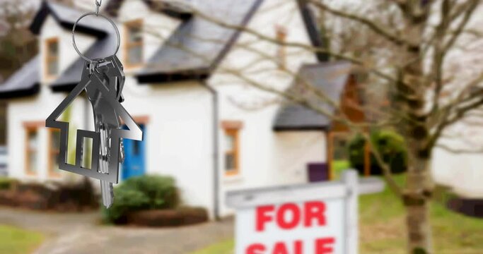 Animation of silver house key fob and key, hanging in front of blurred house with for sale sign
