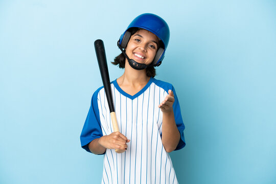 Baseball Mixed Race Player Woman With Helmet And Bat Isolated On Blue Background Shaking Hands For Closing A Good Deal