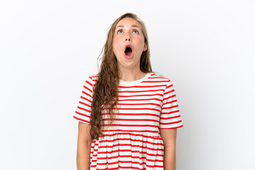 Young caucasian woman isolated on white background looking up and with surprised expression