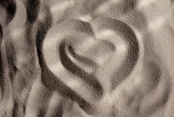 Heart drawn in the sand. Love symbol drawn in the sand
