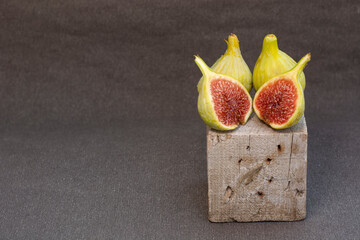 Sliced fresh figs in wooden box 