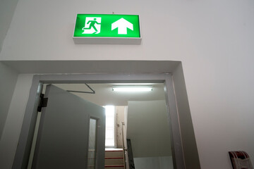 Sign : Emergency exit sign at path way indoor building public facility that emergency escape route...