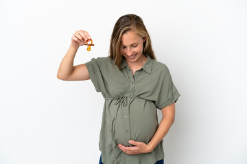 Young caucasian woman isolated on white background pregnant and holding a pacifier