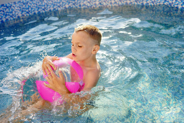 child in pool. Summer. Refreshing procedure. Water. 