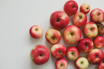 autumn background with fresh red apples isolated on white top view with copyspace