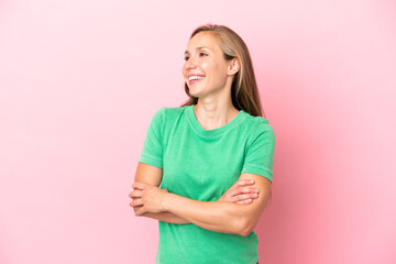 Young English woman isolated on pink background happy and smiling