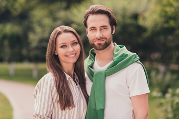 Obraz premium Photo of young couple happy positive smile hug feelings walk park date romantic summer nature outdoors