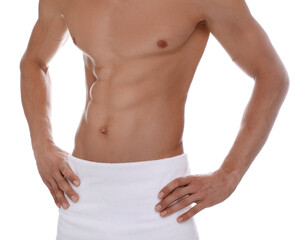 Fototapeta na wymiar Shirtless man with slim body and towel wrapped around his hips isolated on white, closeup
