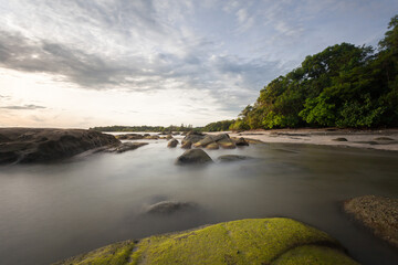 Naklejka na ściany i meble long exposure capture of coast in borneo - malaysia.