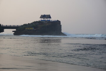Obraz premium Mesra beach with a natural background. Mesra means intimate. Mesra beach also known as kukup beach or ngrawe beach