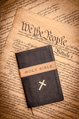 Holy bible and small cross on the constitution.