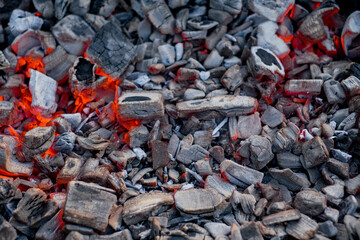 Burning coal in iron brazier. Preparation for barbecue. Fireplace with red embers