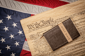 Holy bible on constitution and American Flag