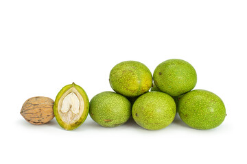 Fresh green walnuts on isolated white background