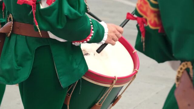Drummer In Traditional Costume Playing on Drum during Street Festival Celebration
