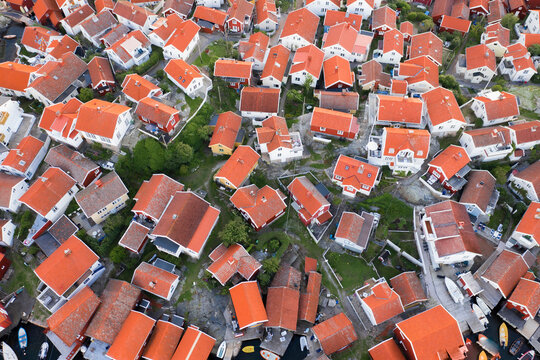 Aerial view of red rooftops and buildings in densely residential area