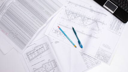 Naklejka na ściany i meble drawings of a construction engineer on a sheet of paper