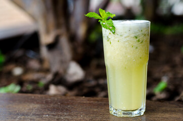 Pineapple Juice in a glass with mint leaf