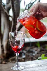 putting drink on a glass
