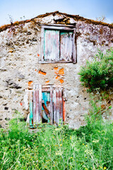 Fototapeta na wymiar Old deserted house with wooden door