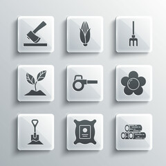 Set Pack full of seeds of plant, Wooden logs, Flower, Leaf garden blower, Shovel in the ground, Plant, axe and Garden rake icon. Vector