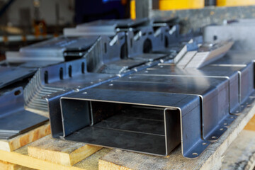 Sheet metal product after processing on a bending machine. Production of fastening from metal for construction.