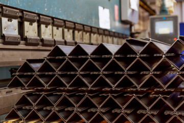 Sheet metal product after processing on a bending machine. Production of fastening from metal for construction.
