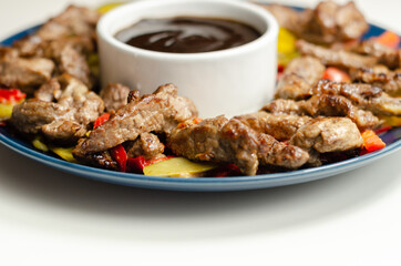 Beef strips with mixed peppers and mangetout served with black bean sauce