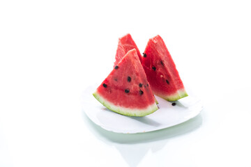 pieces of fresh ripe red watermelon on white