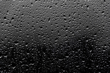 Background photo of rain drops on dark glass