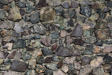 Wall of stones and concrete