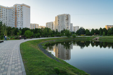 Summer sunset view of Yuzhnoe Butovo park in South Butovo district, Moscow, Russia.