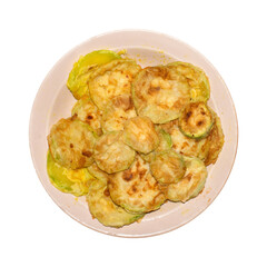 Zucchini fried in sunflower oil.Grilled zucchini.Fried zucchini on a plate.Fried zucchini on a white background.