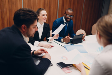 Business team at office meeting. Business people group conference discussion sit at table with boss...