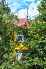 Yellow house with red tiled roof