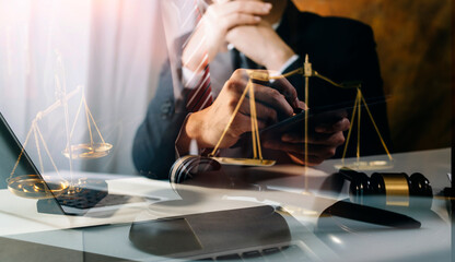 Business and lawyers discussing contract papers with brass scale on desk in office. Law, legal services, advice, justice and law concept picture with film grain effect