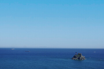 a small rocky island in the sea